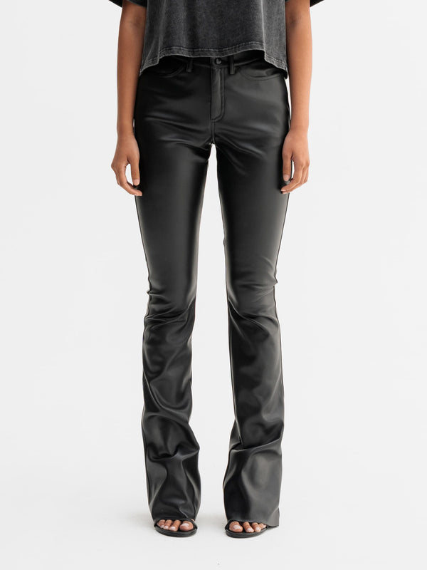 Model wearing Ahlvar Gallery Aiko PU leather trousers in Black