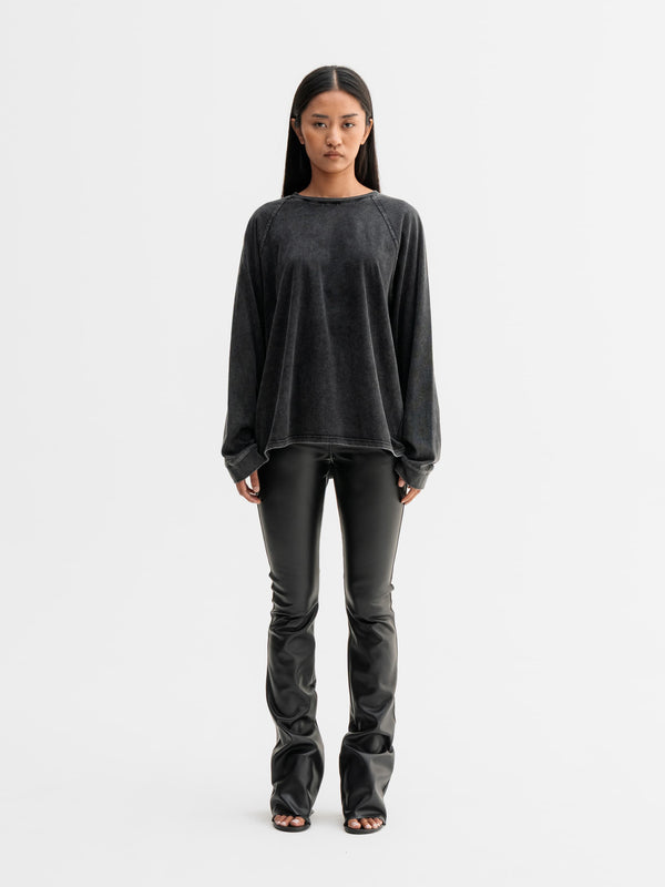 Model wearing Ahlvar Gallery Aiko PU leather trousers in Black
