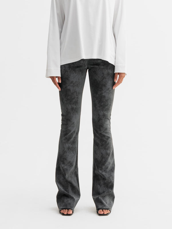 Model wearing Ahlvar Gallery Aiko PU leather trousers in Dark grey