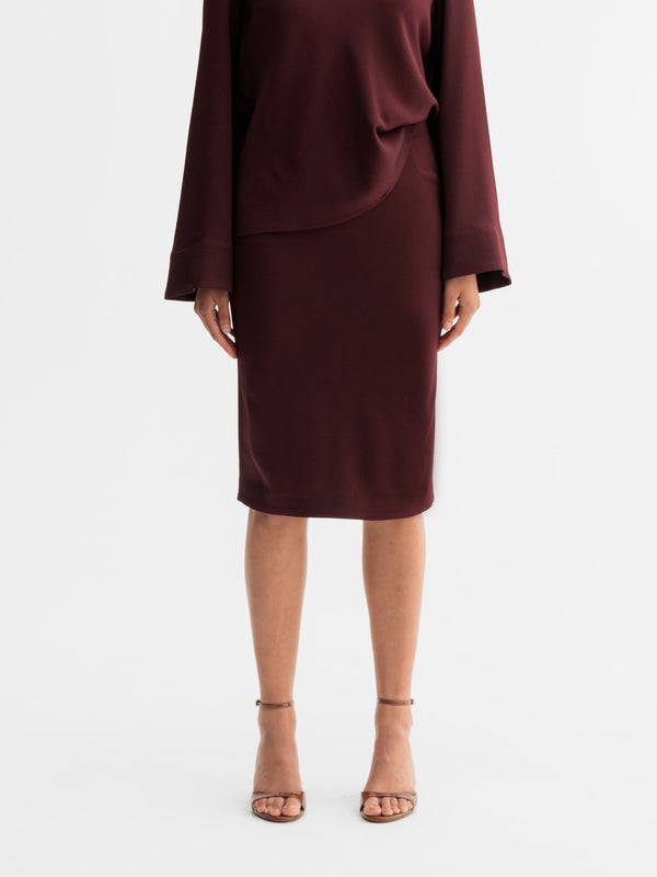 Model wearing Ahlvar Gallery Alila skirt in Burgundy