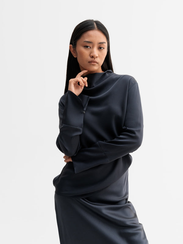 Model wearing Ahlvar Gallery Ayumi silk blouse in Blue grey