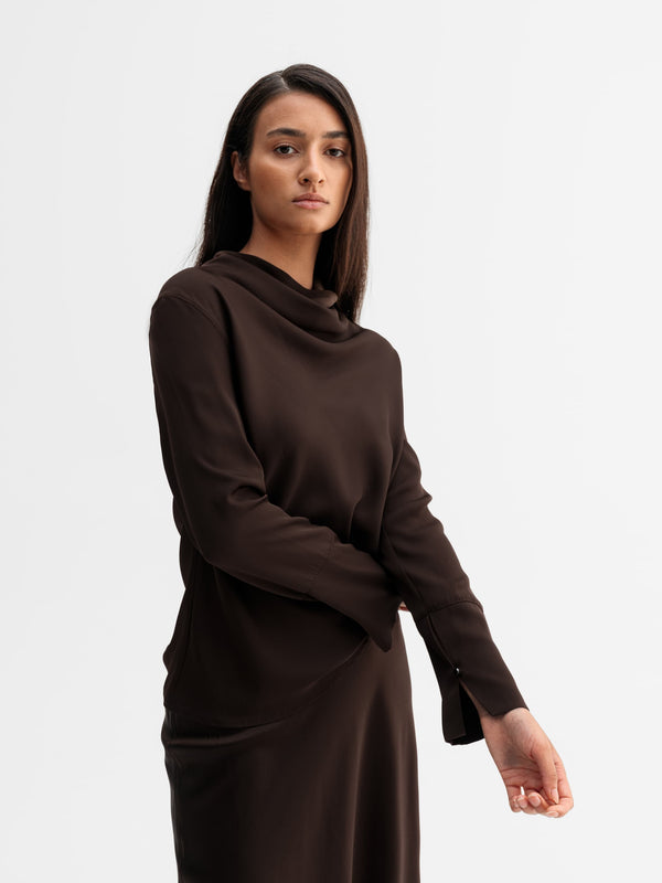 Model wearing Ahlvar Gallery Ayumi silk blouse in Dark brown