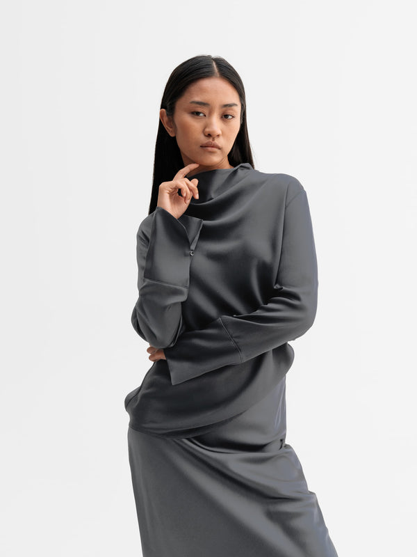Model wearing Ahlvar Gallery Ayumi silk blouse in Dark grey