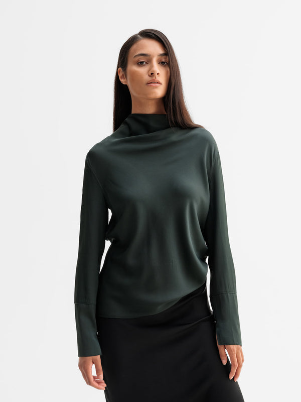 Model wearing Ahlvar Gallery Ayumi silk blouse in Deep forest