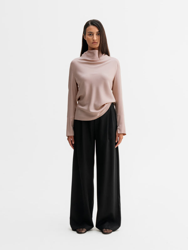 Model wearing Ahlvar Gallery Ayumi silk blouse in Dusty pink