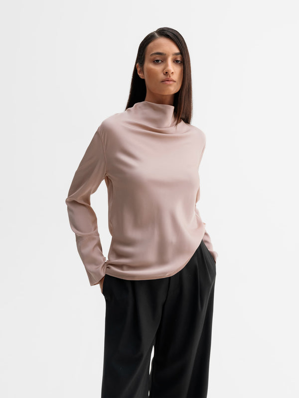 Model wearing Ahlvar Gallery Ayumi silk blouse in Dusty pink