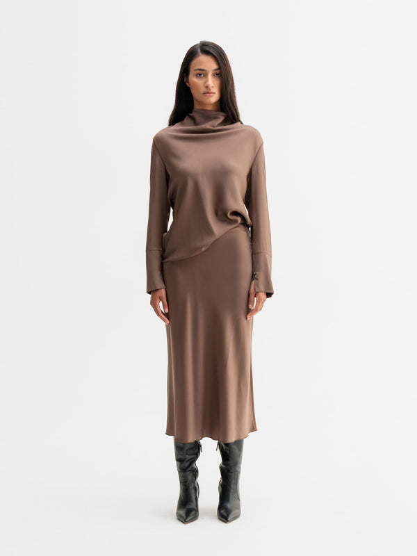 Model wearing Ahlvar Gallery Ayumi silk blouse in Light brown