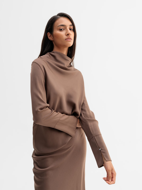 Model wearing Ahlvar Gallery Ayumi silk blouse in Light brown
