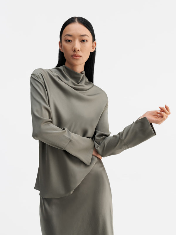 Model wearing Ahlvar Gallery Ayumi silk blouse light military