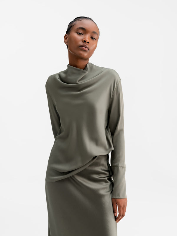 Model wearing Ahlvar Gallery Ayumi silk blouse light military