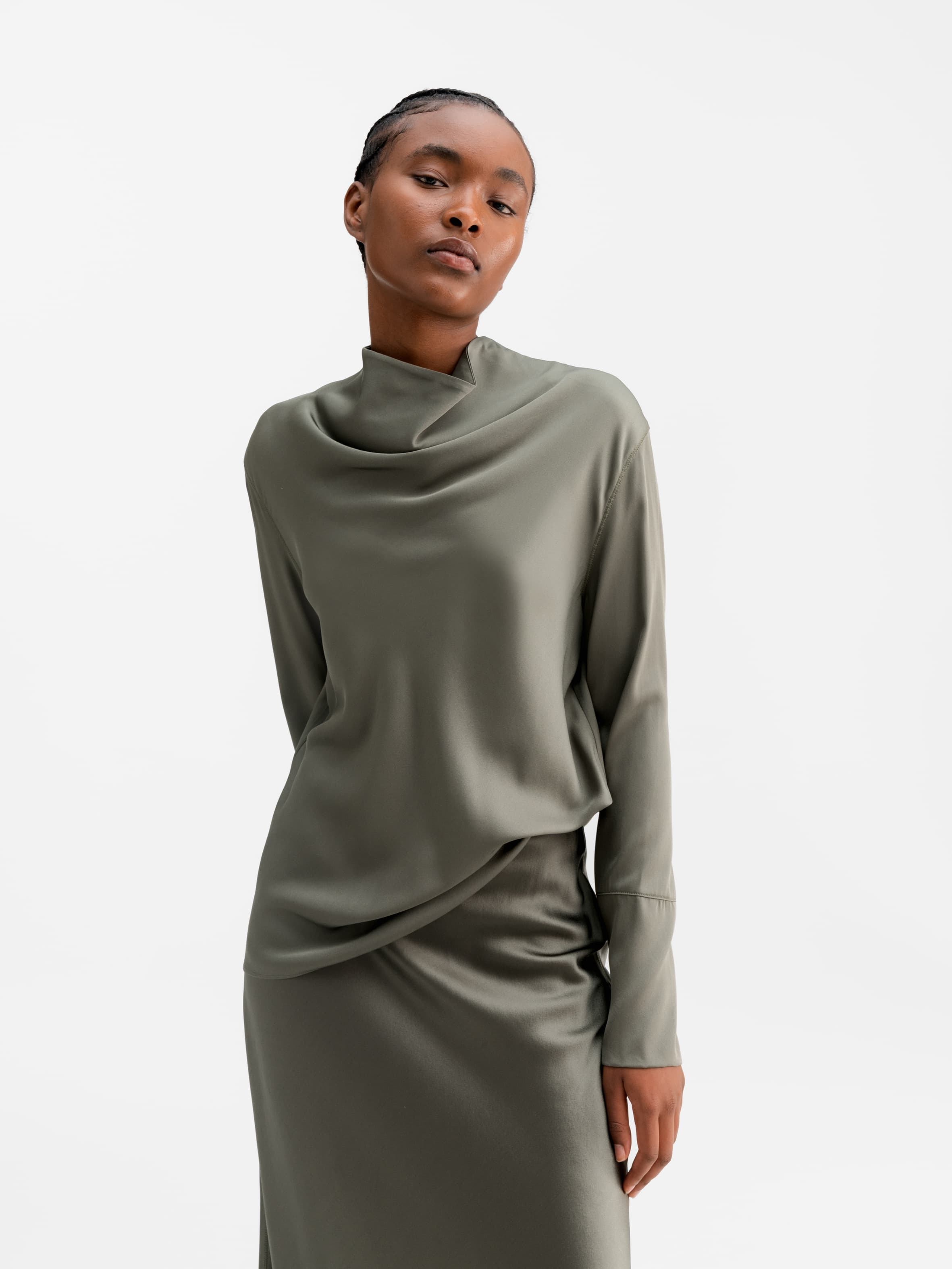 Model wearing Ahlvar Gallery Ayumi silk blouse light military