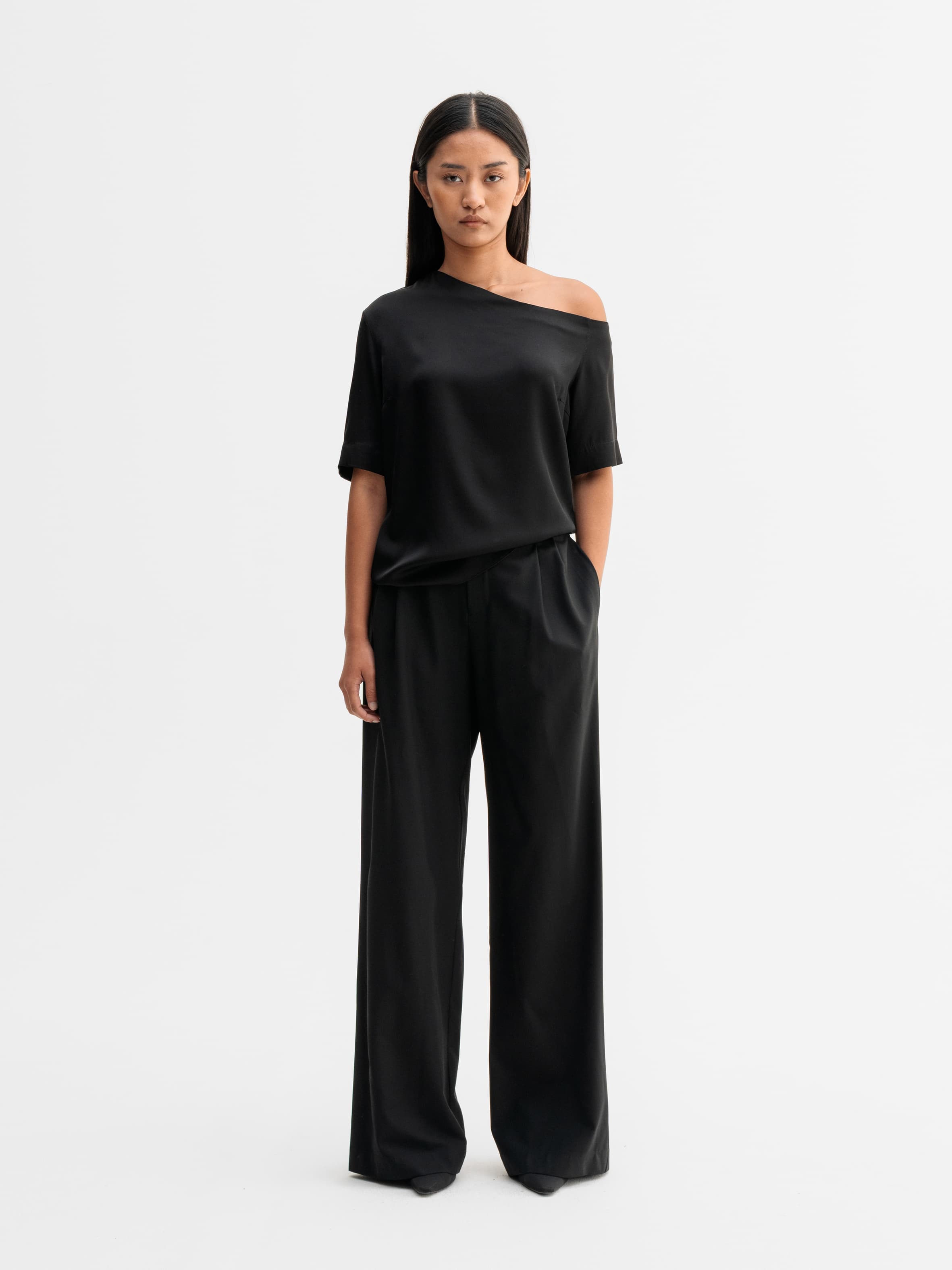 Model wearing Ahlvar Gallery Chima silk blouse in Black
