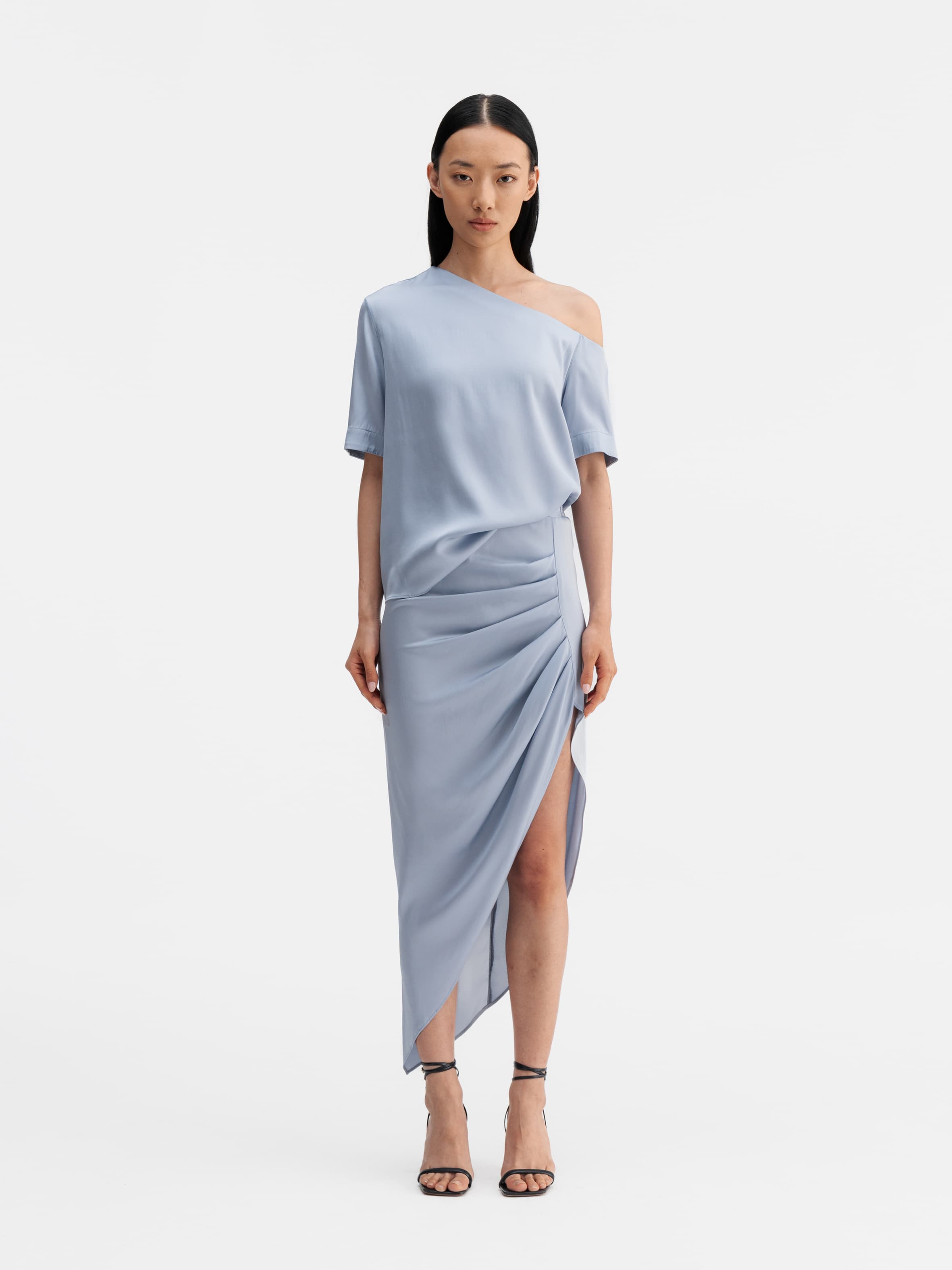 Model wearing Ahlvar Gallery Chima silk blouse denim blue
