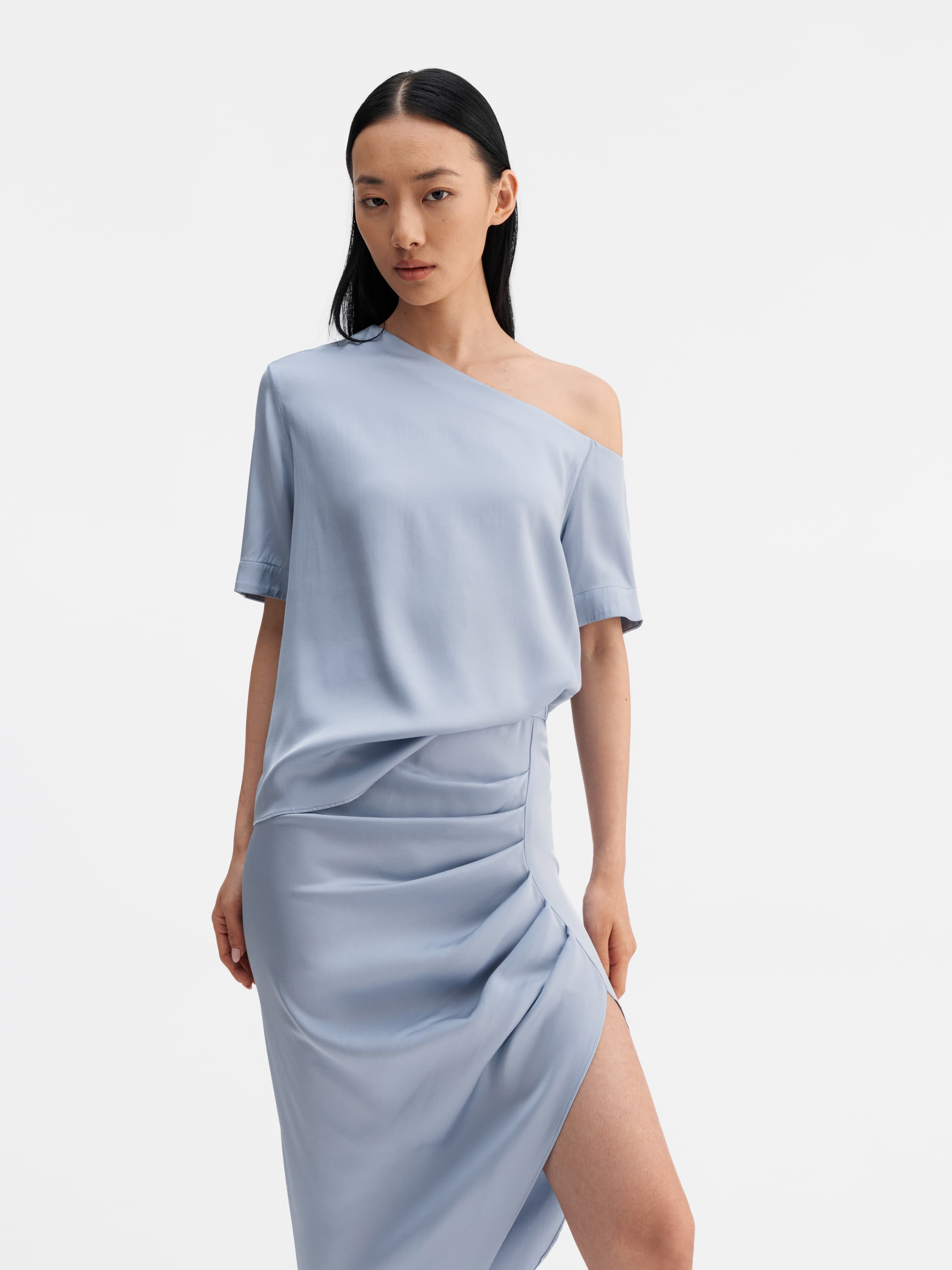 Model wearing Ahlvar Gallery Chima silk blouse denim blue