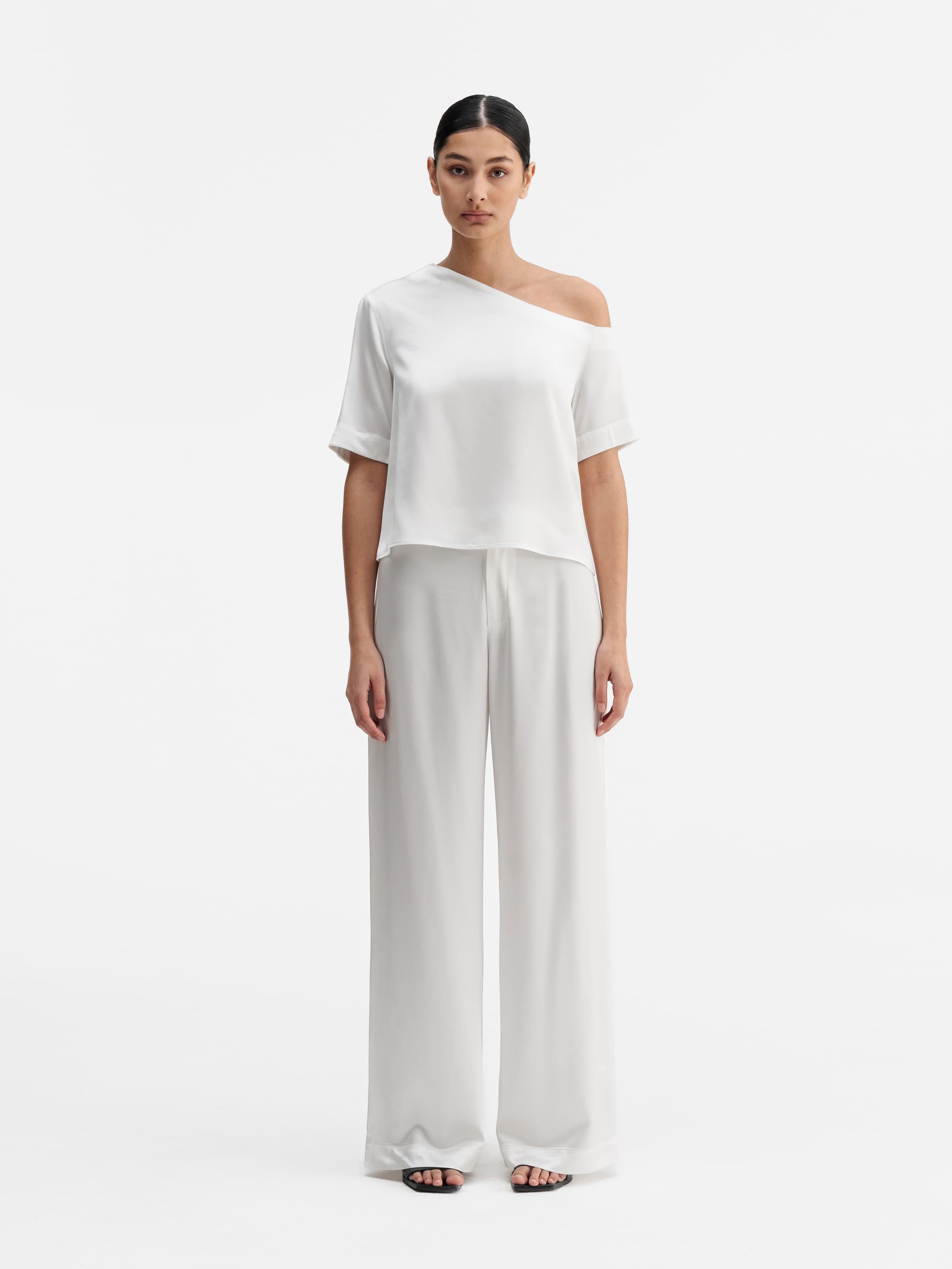 Model wearing Ahlvar Gallery Chima cropped heavy satin blouse white