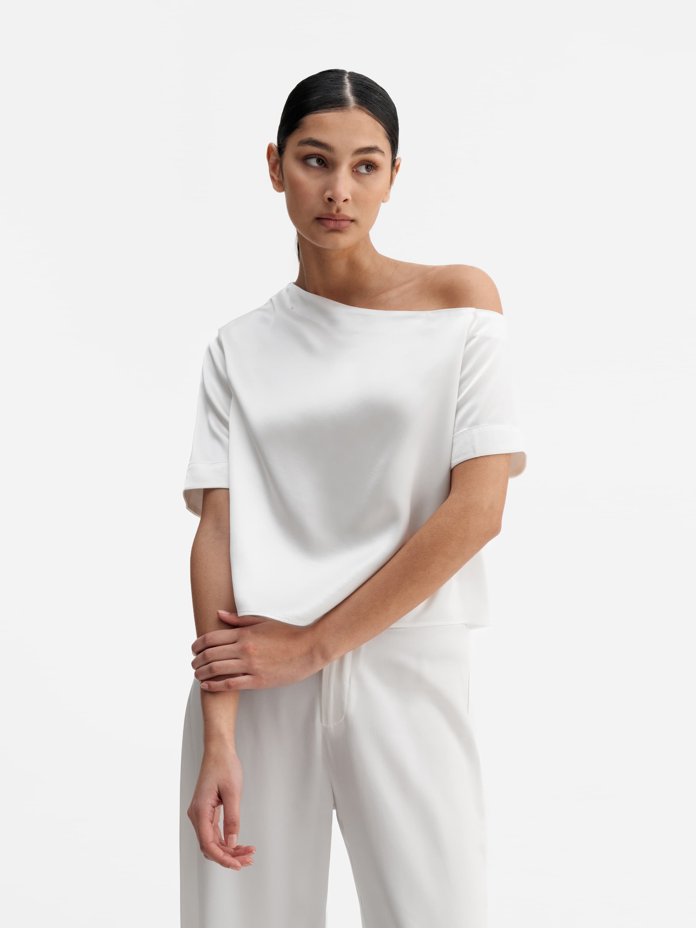 Model wearing Ahlvar Gallery Chima cropped heavy satin blouse white