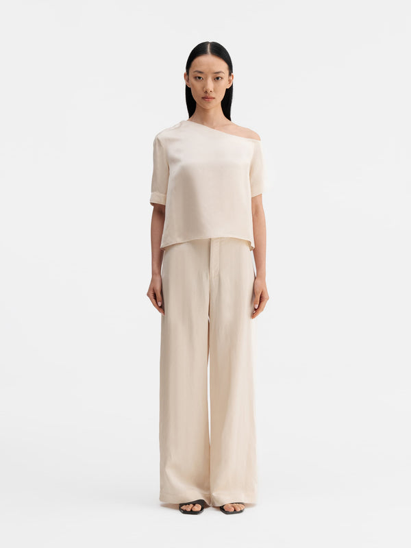 Model wearing Ahlvar Gallery Chima cropped linen blouse cream