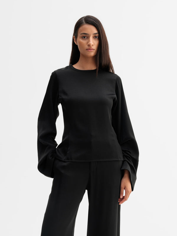 Model wearing Ahlvar Gallery Dara blouse in Black