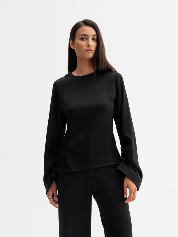 Model wearing Ahlvar Gallery Dara blouse in Black