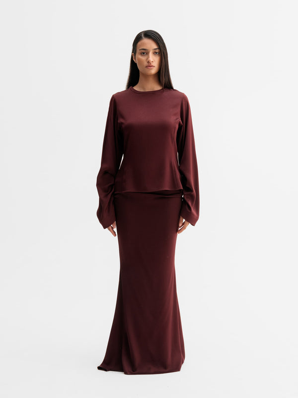 Model wearing Ahlvar Gallery Dara blouse in Burgundy