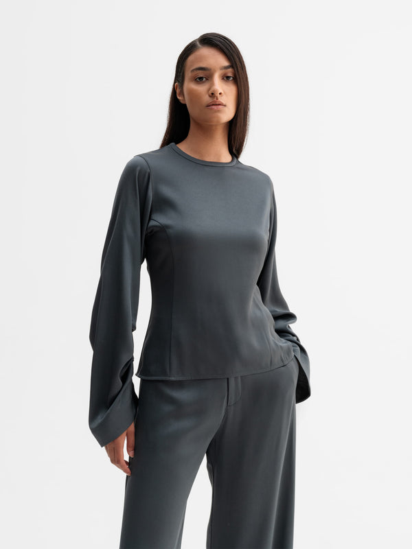 Model wearing Ahlvar Gallery Dara blouse in Dark grey