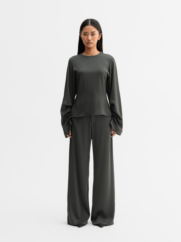 Model wearing Ahlvar Gallery Dara blouse in Wood