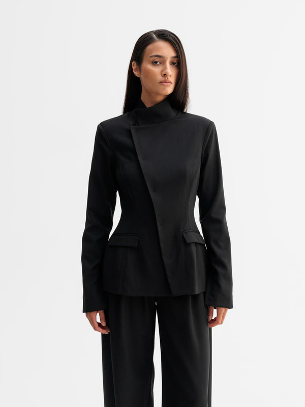 Model wearing Ahlvar Gallery Daya wool blazer in Black