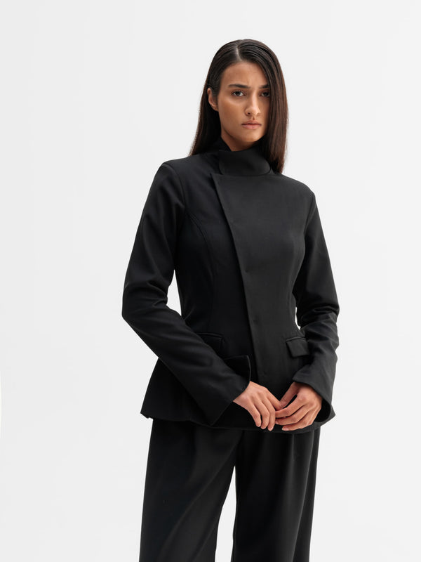 Model wearing Ahlvar Gallery Daya wool blazer in Black