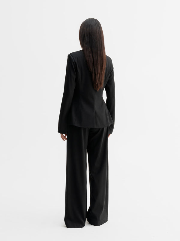 Back view of Ahlvar Gallery Daya wool blazer in Black