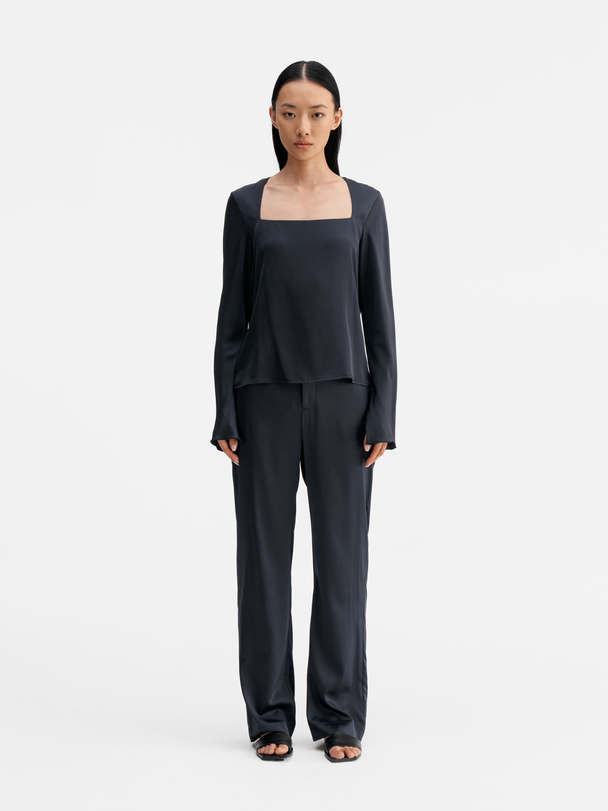 Model wearing Ahlvar Gallery Della silk blouse blue grey