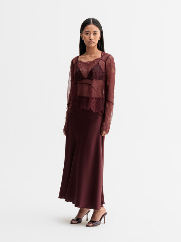 Model wearing Ahlvar Gallery Della lace blouse in Burgundy