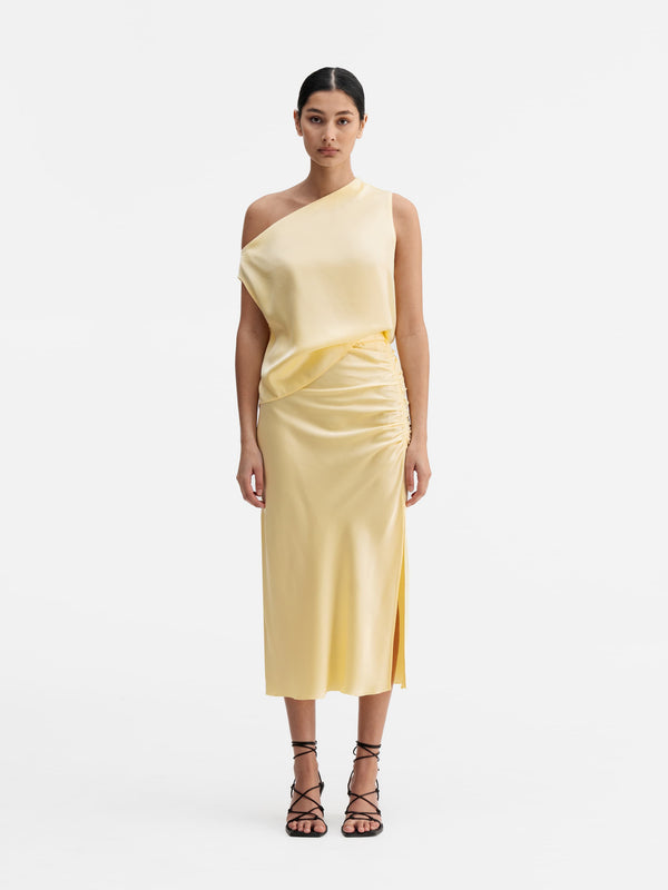 Model wearing Ahlvar Gallery Dina satin skirt light yellow