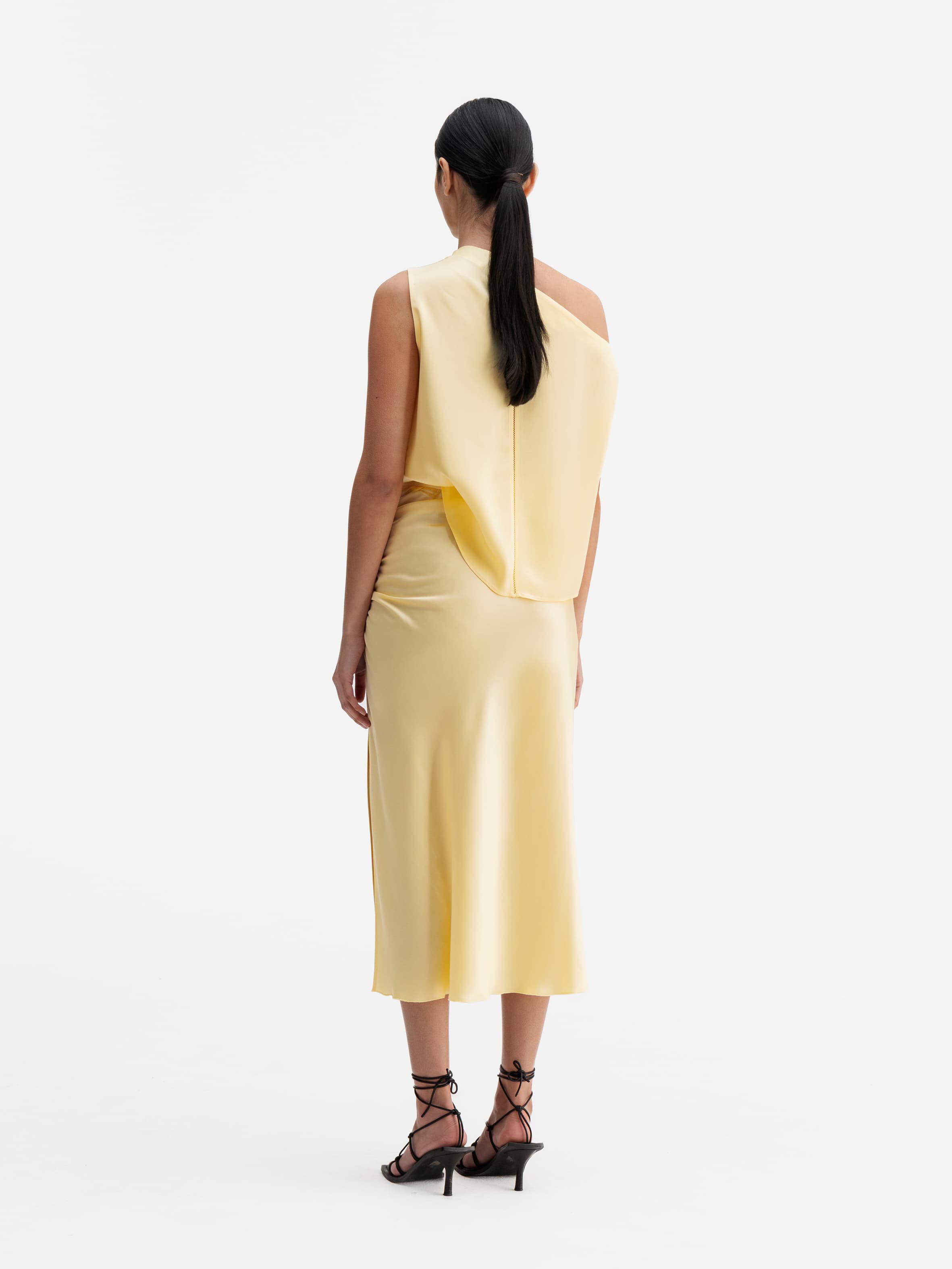 Back view of Ahlvar Gallery Dina satin skirt light yellow