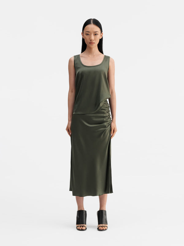 Model wearing Ahlvar Gallery Dina satin skirt olive green