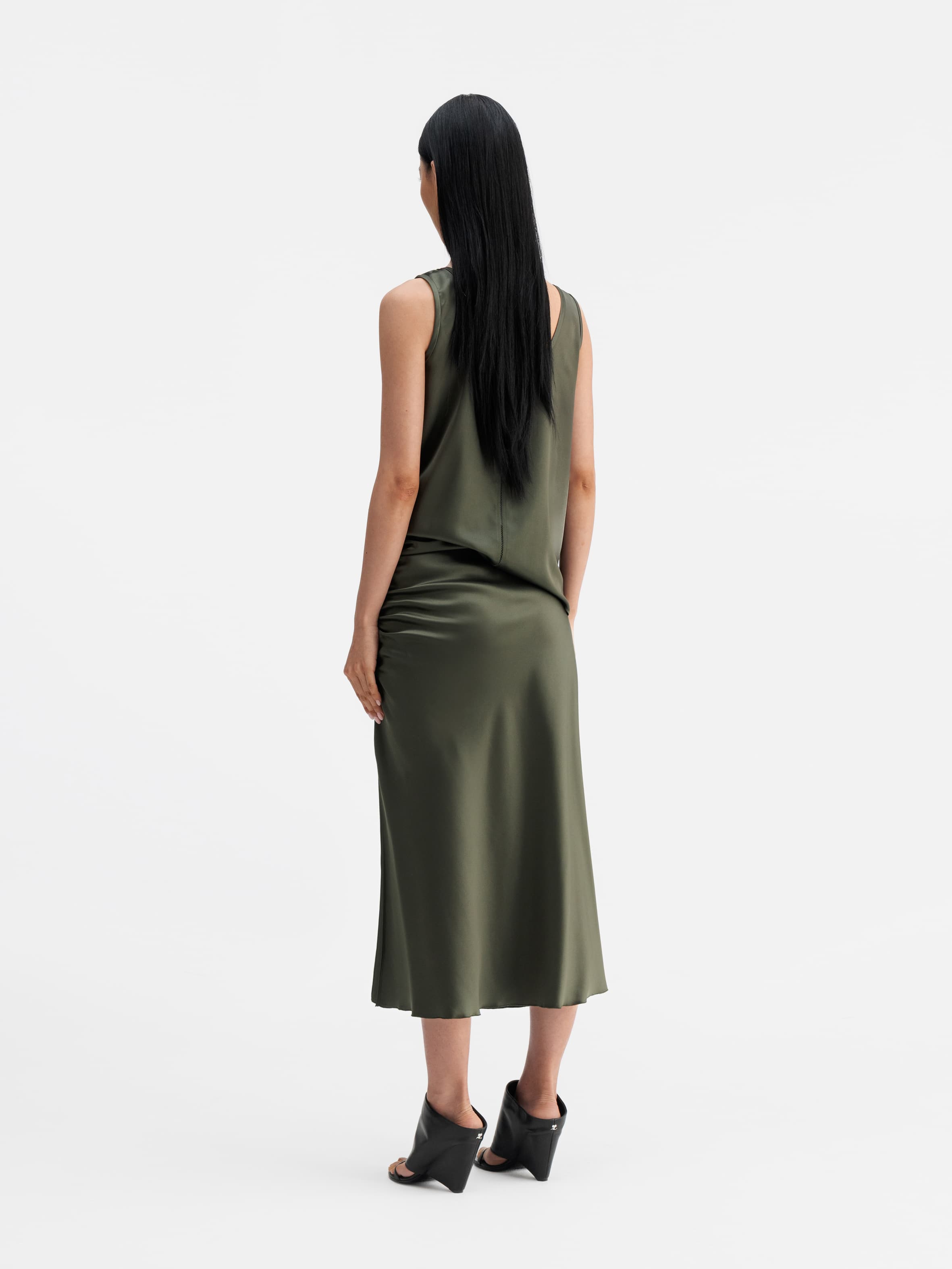 Back view of Ahlvar Gallery Dina satin skirt olive green