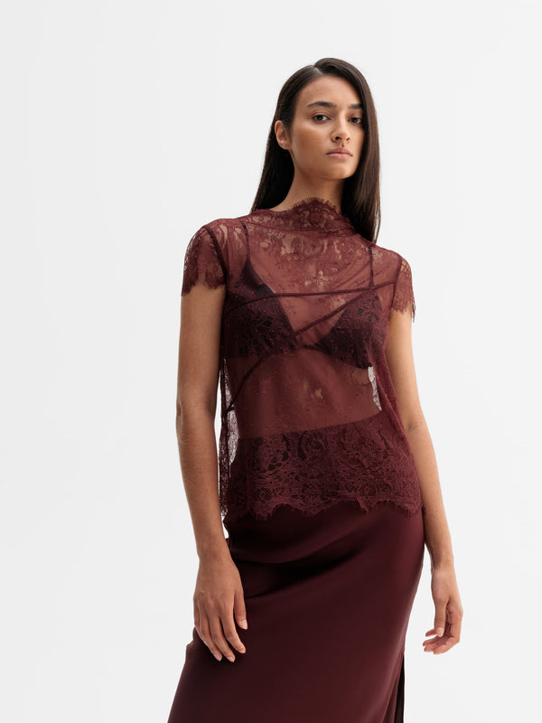 Model wearing Ahlvar Gallery Eden lace top in Burgundy