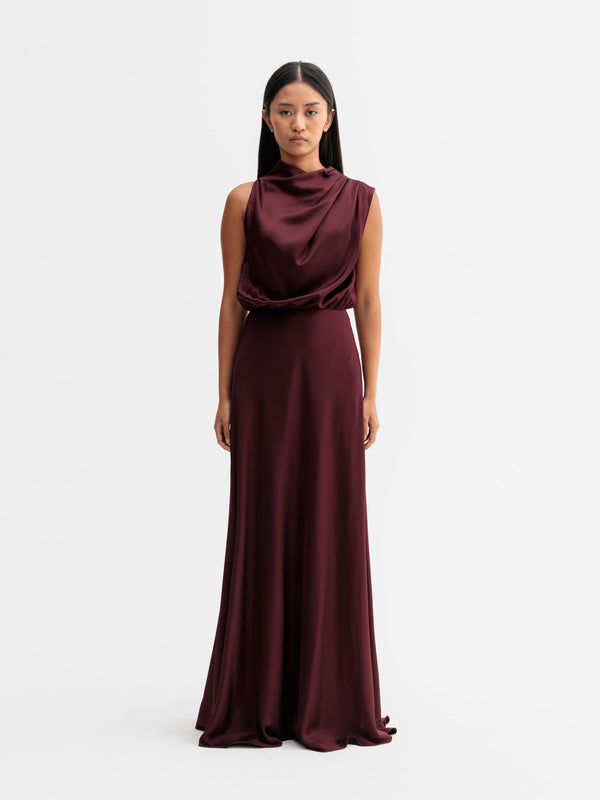 Model wearing Ahlvar Gallery Eli satin dress in Burgundy