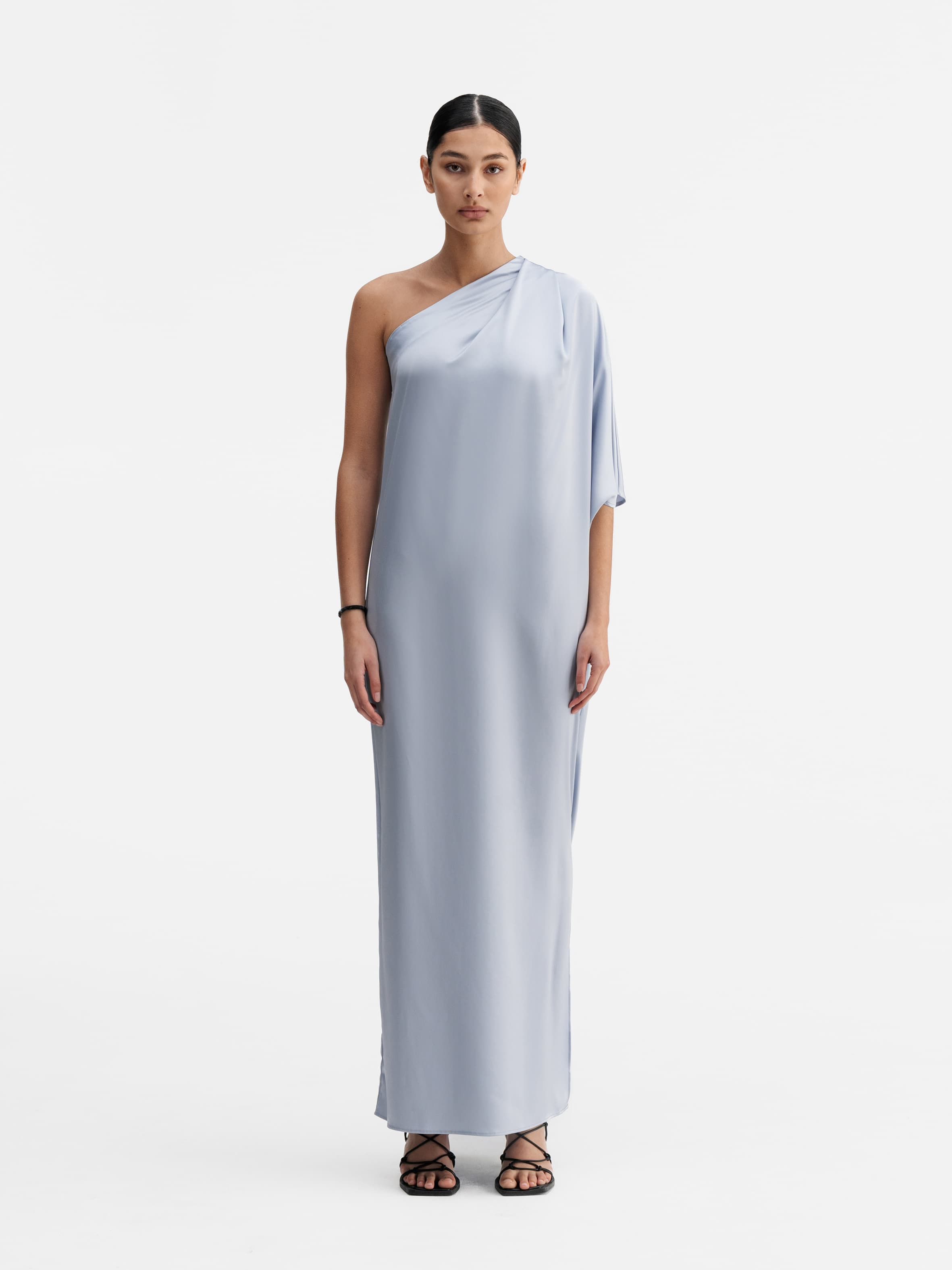 Model wearing Ahlvar Gallery Ella satin dress denim blue