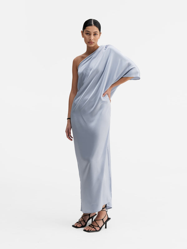 Model wearing Ahlvar Gallery Ella satin dress denim blue