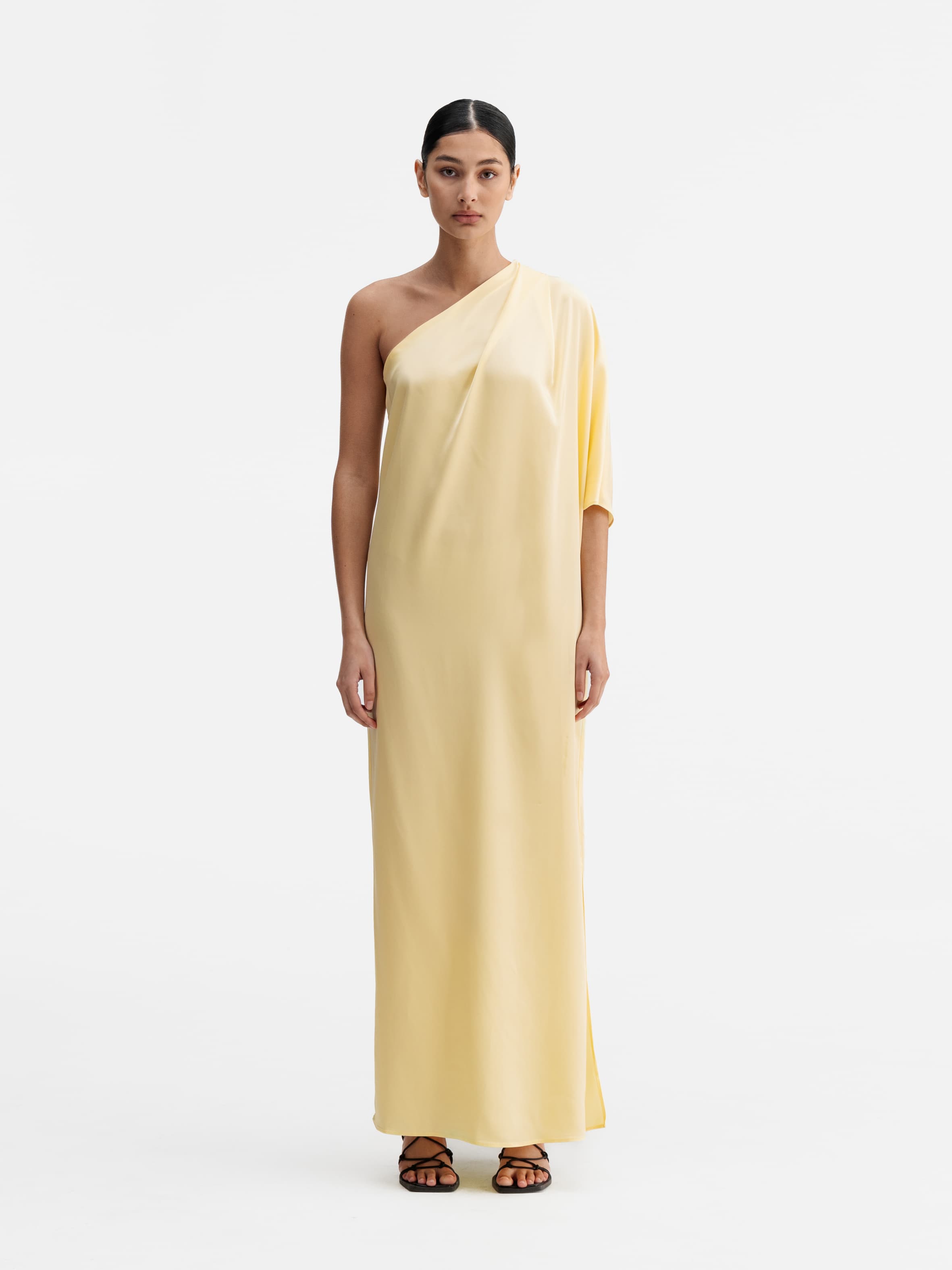 Model wearing Ahlvar Gallery Ella satin dress light yellow