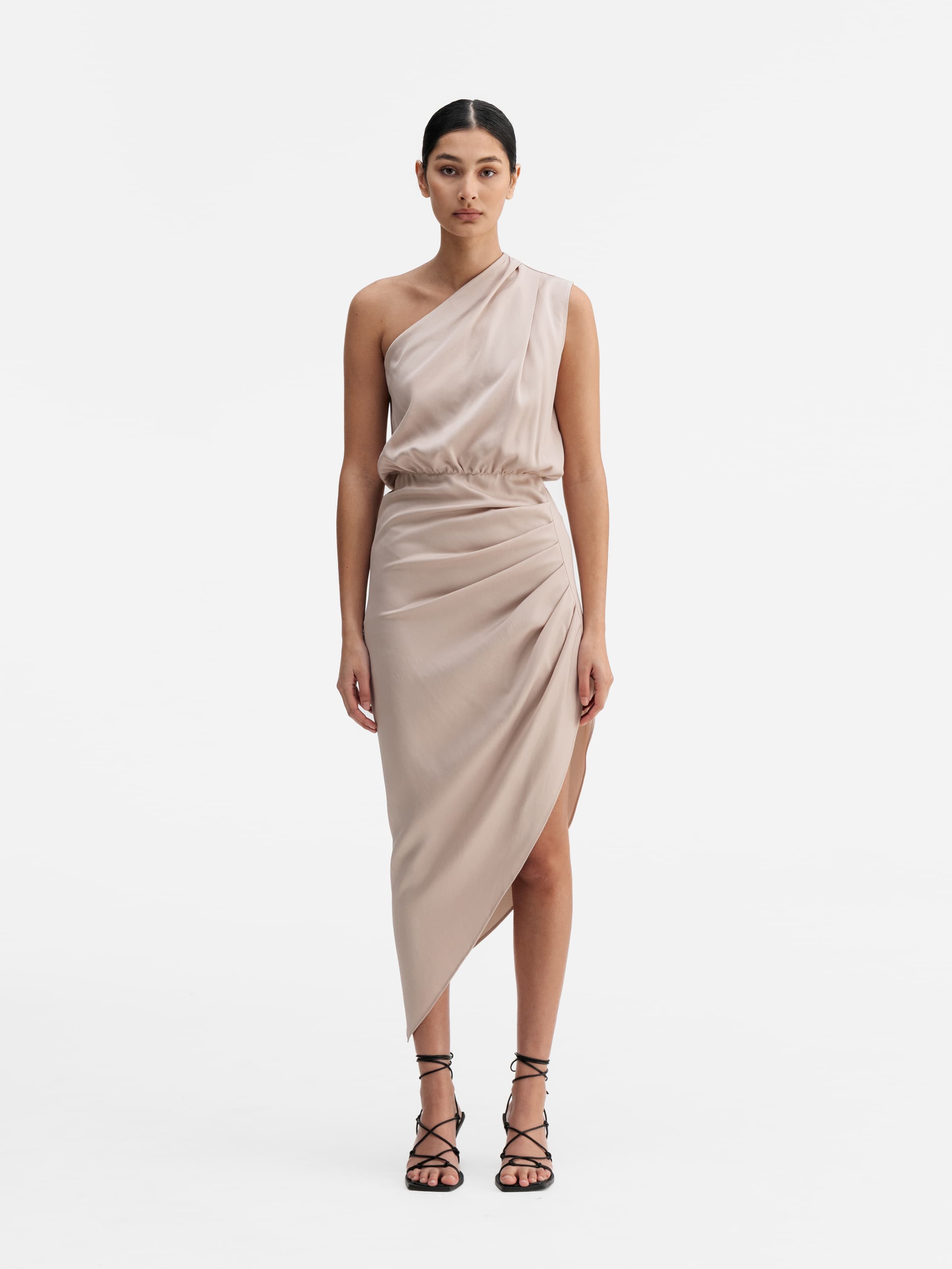 Model wearing Ahlvar Gallery Elle dress  in  greige