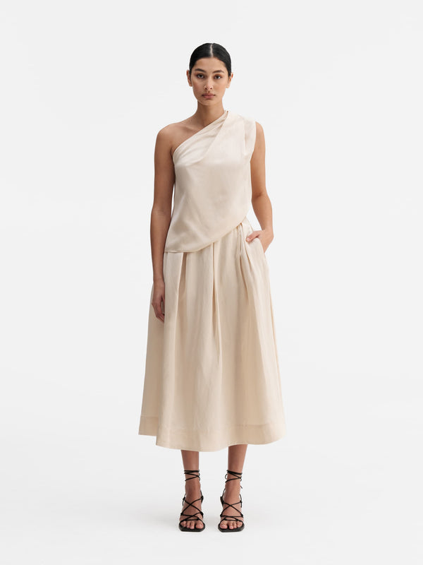 Model wearing Ahlvar Gallery Elle satin linen tank cream