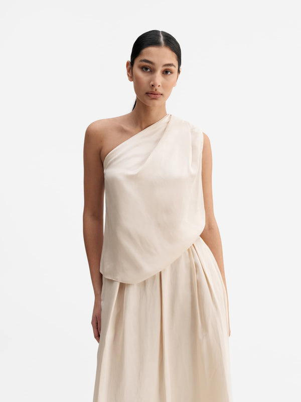 Model wearing Ahlvar Gallery Elle satin linen tank cream