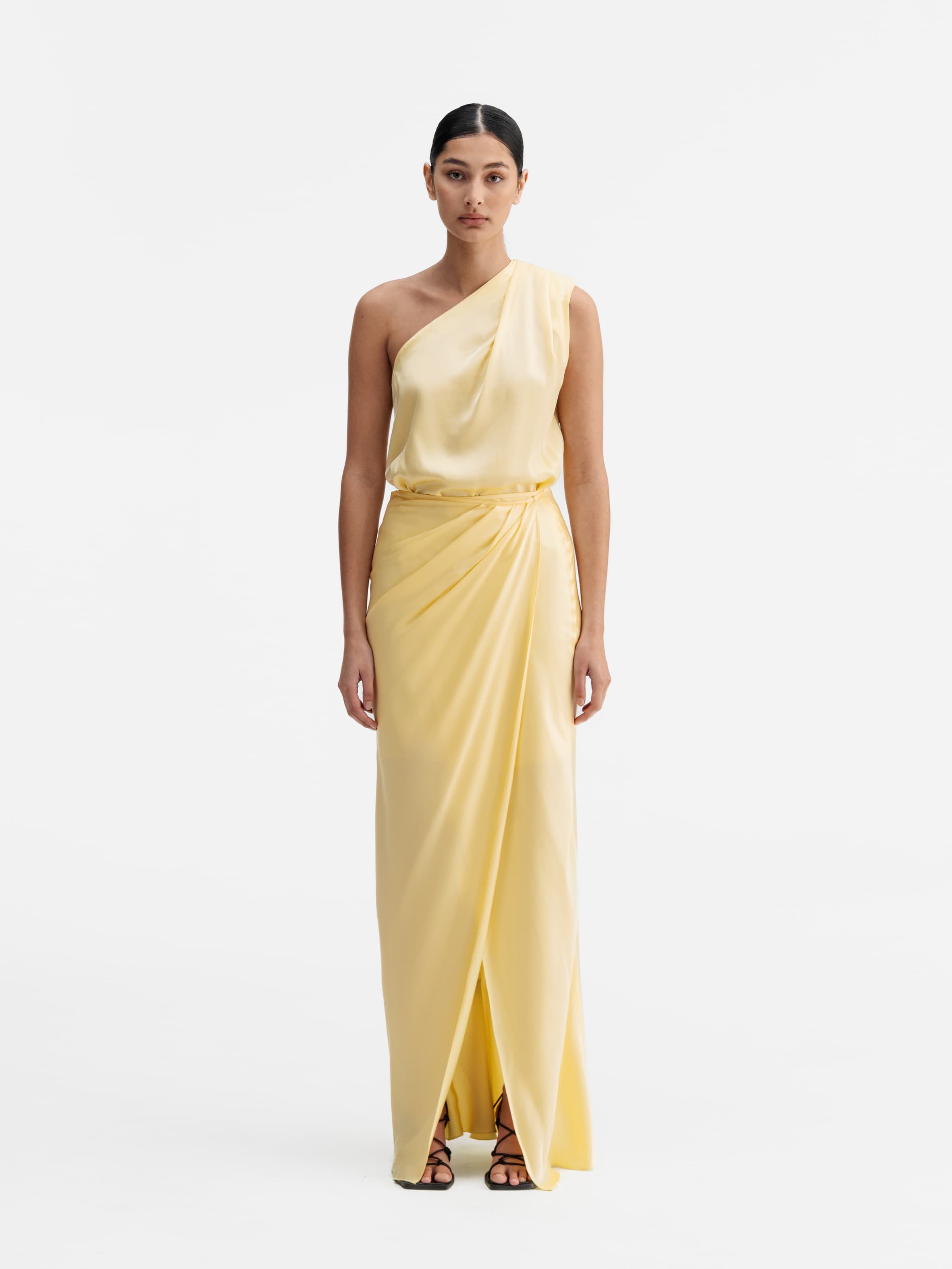 Model wearing Ahlvar Gallery Elle satin wrap dress light yellow