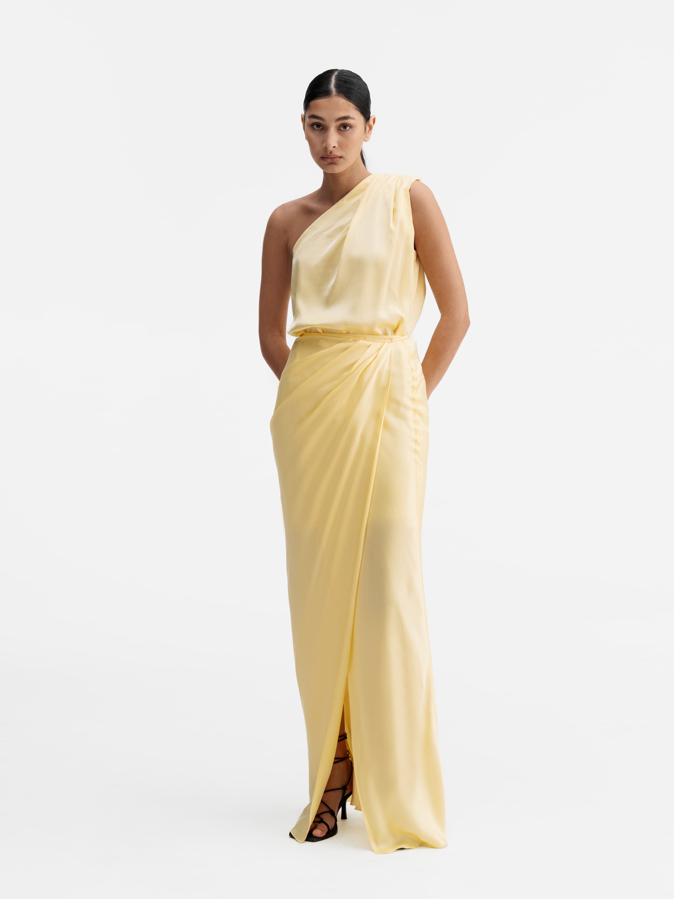 Model wearing Ahlvar Gallery Elle satin wrap dress light yellow