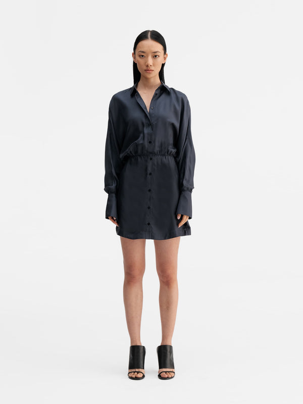 Model wearing Ahlvar Gallery Gia silk twill shirt dress blue grey