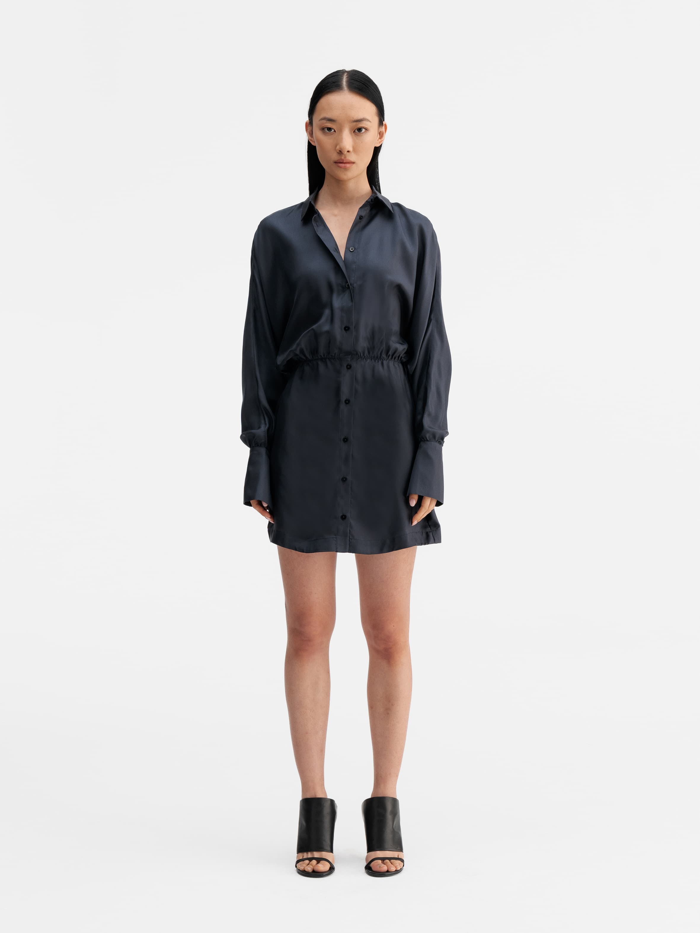 Model wearing Ahlvar Gallery Gia silk twill shirt dress blue grey