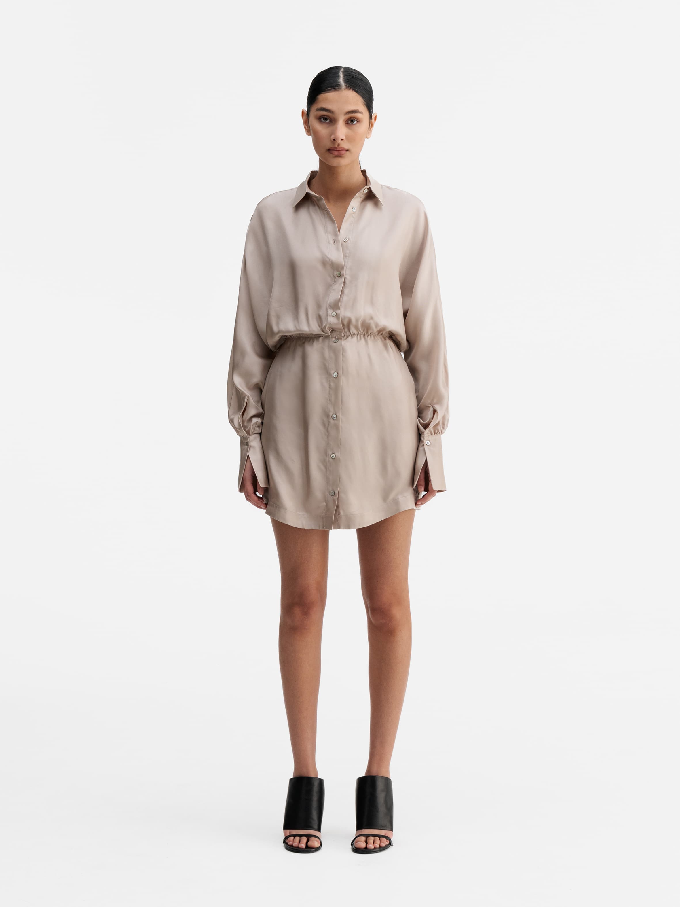 Model wearing Ahlvar Gallery Gia silk twill shirt dress greige