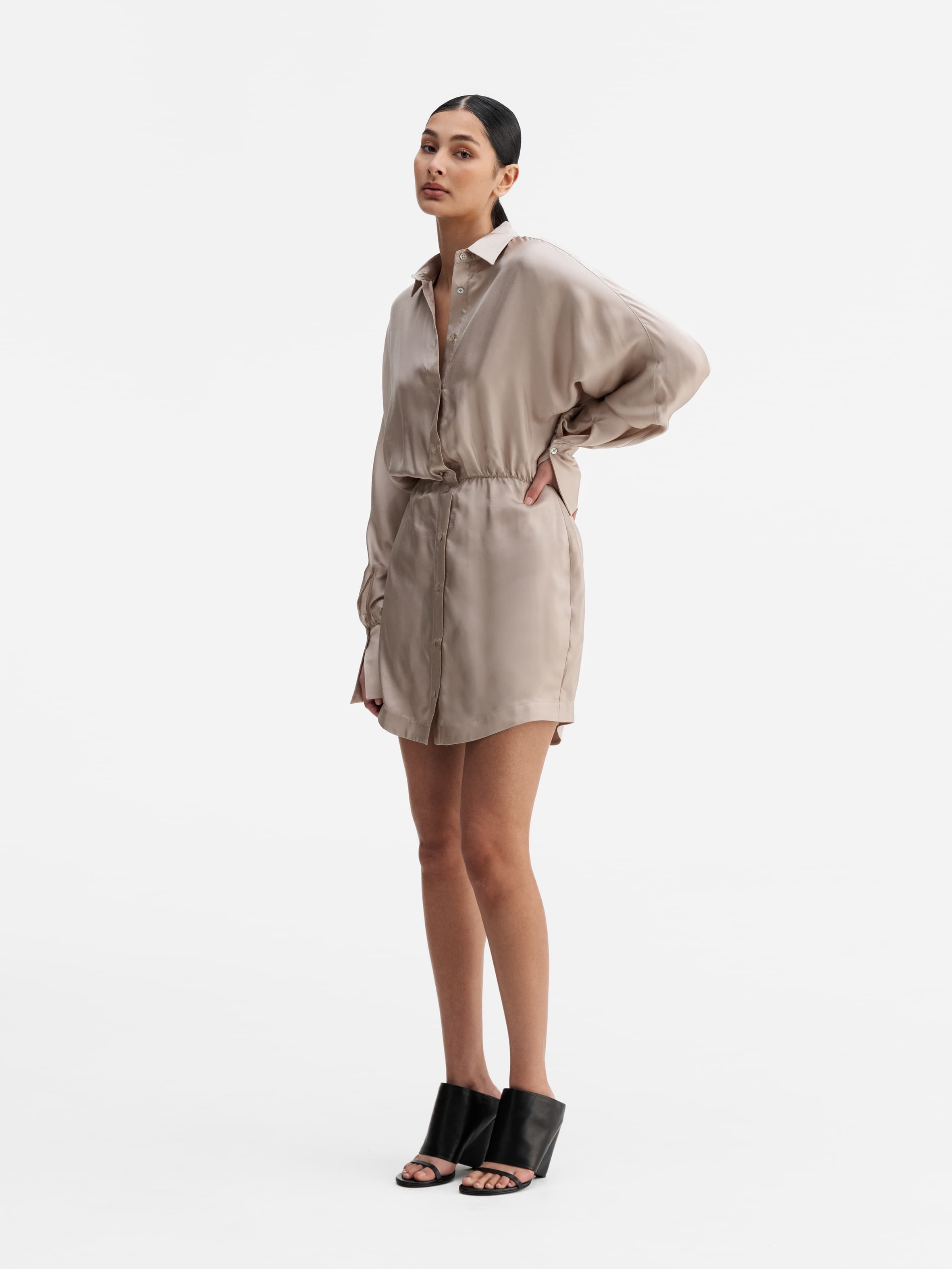 Model wearing Ahlvar Gallery Gia silk twill shirt dress greige