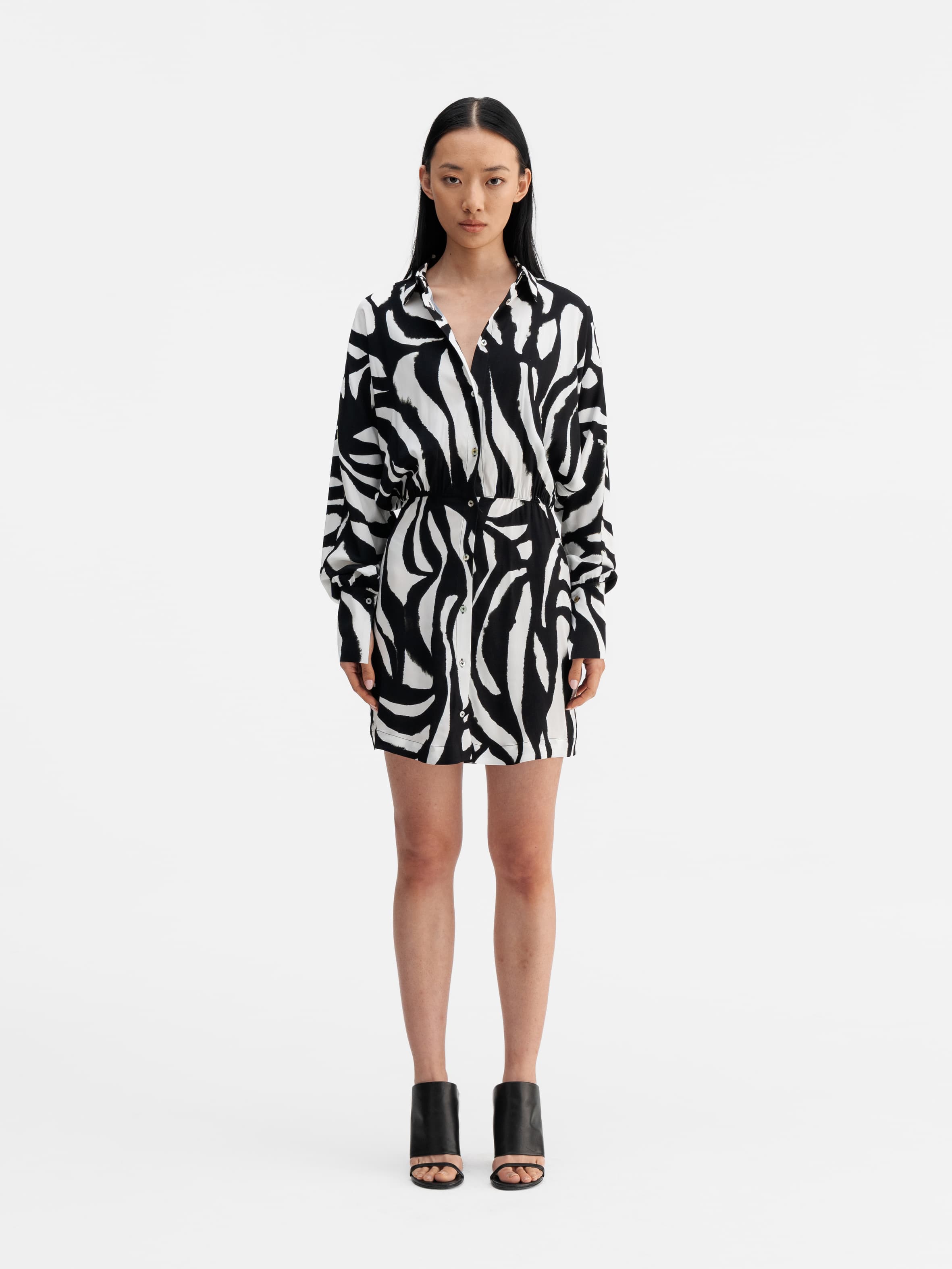 Model wearing Ahlvar Gallery Gia zebra shirt dress white